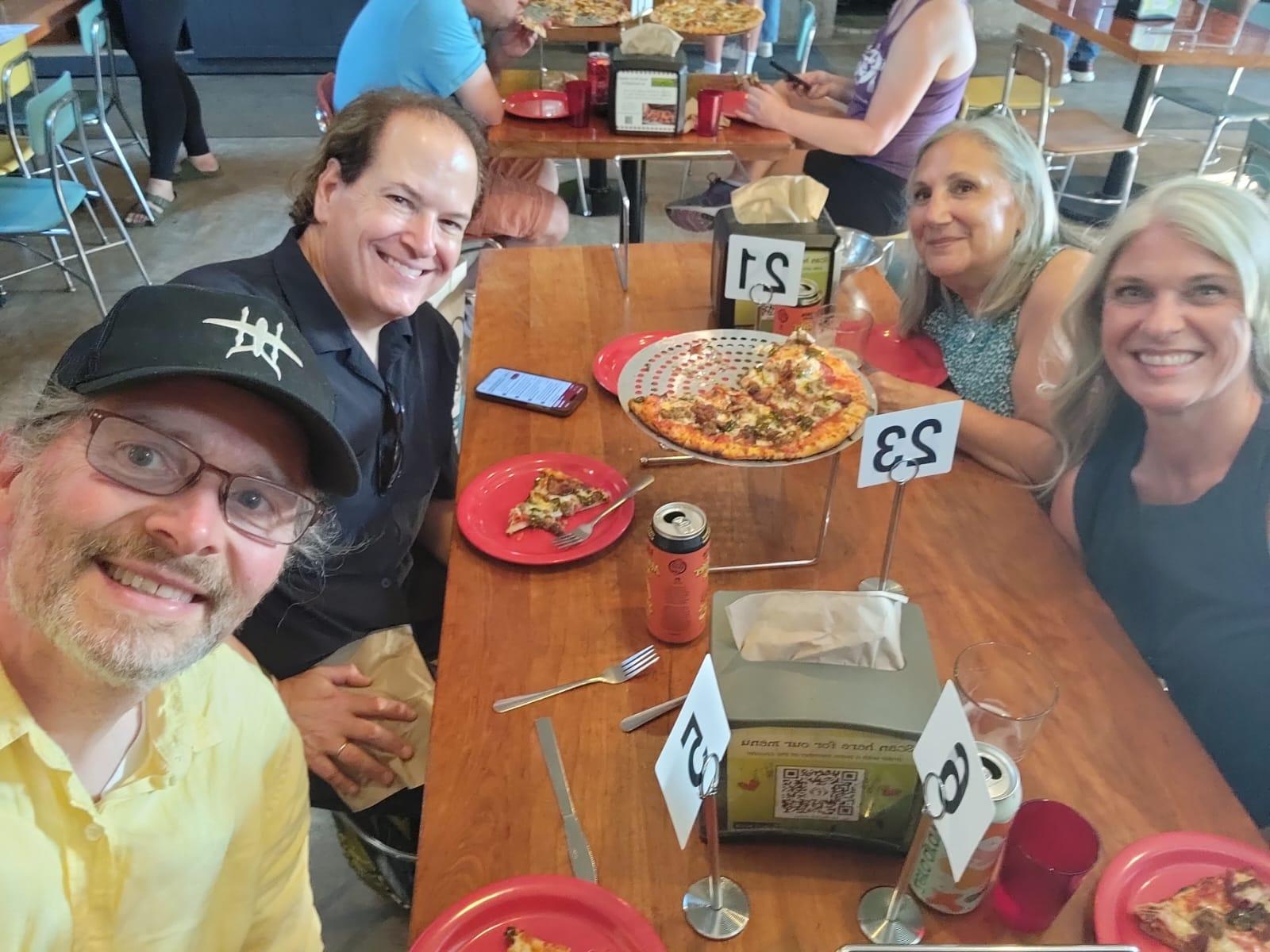 2024 USASBE Rural Entrepreneurship Symposium attendees eat local pizza.