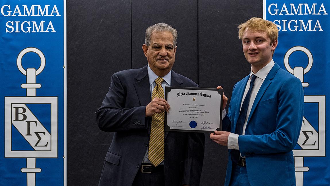 Jasper Williams is congratulated by Dean Sanjay Sharma.