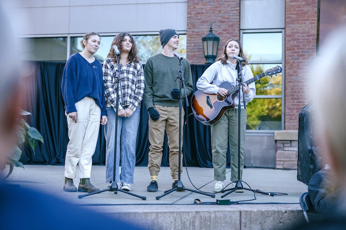 students singing and playing guitar
