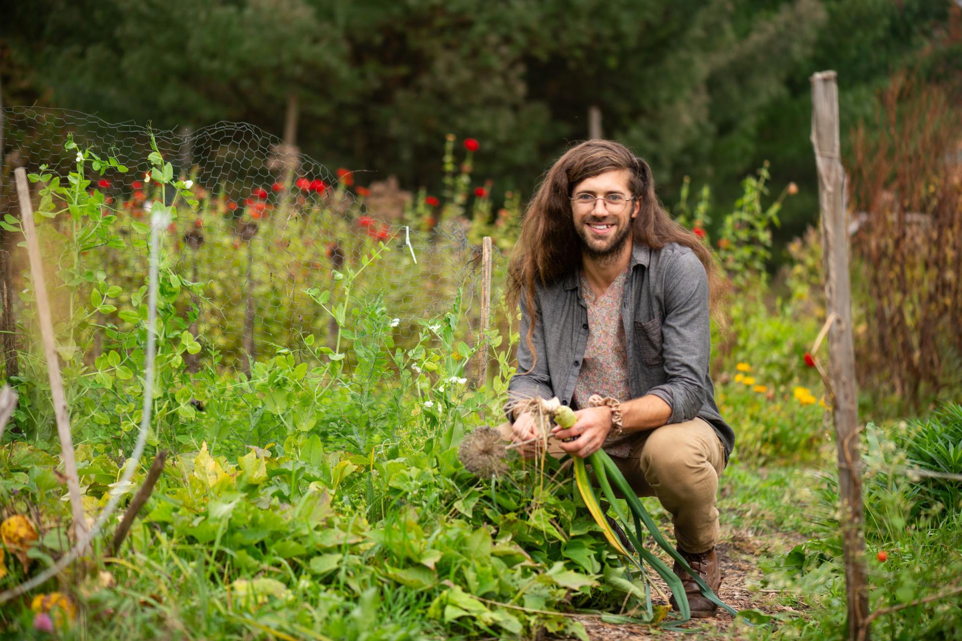 Sam Bliss tends to his community garden plot