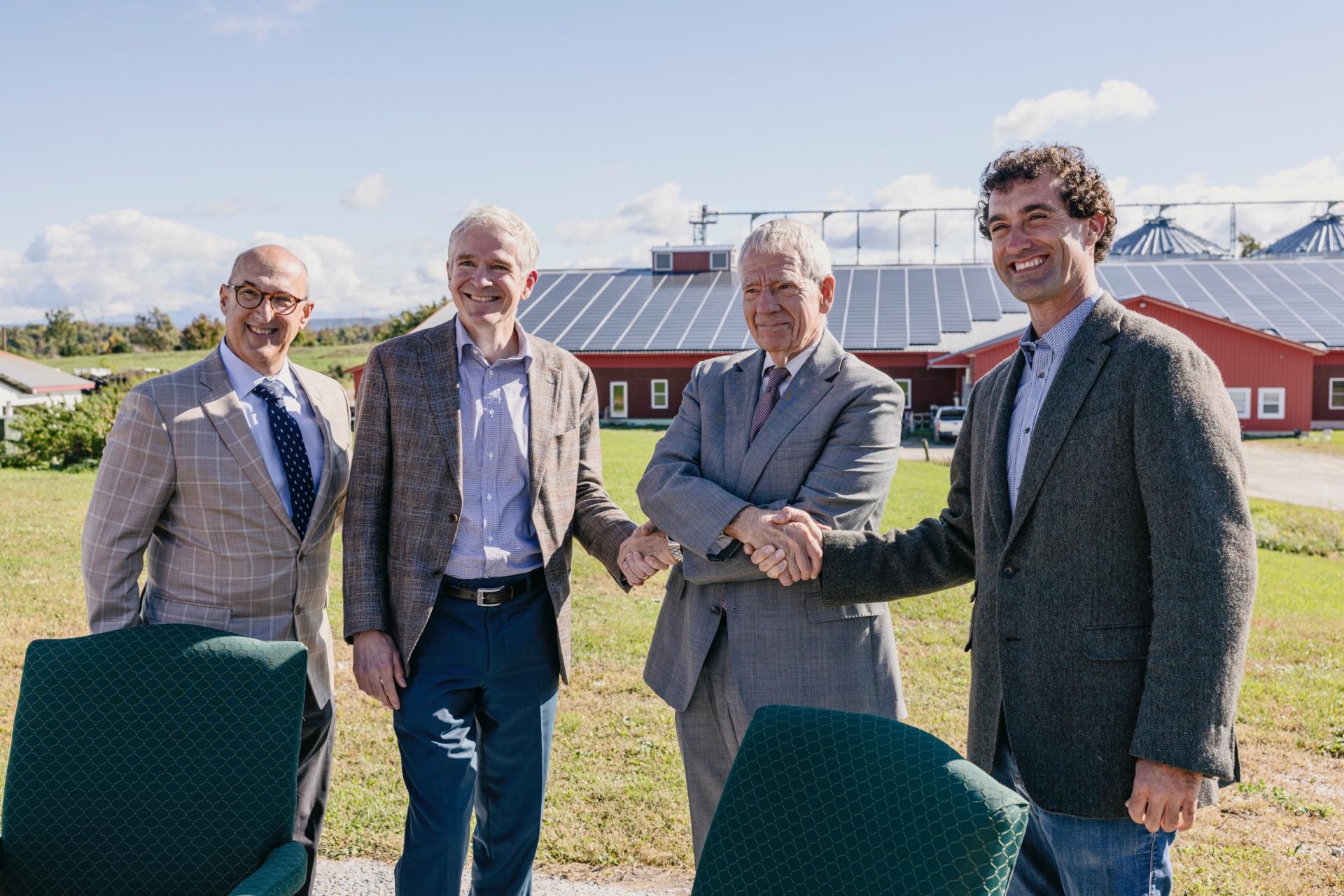Nordic Farm co-owner Benjamin Dobson and officials from UVM and the USDA celebrate a long-term lease agreement
