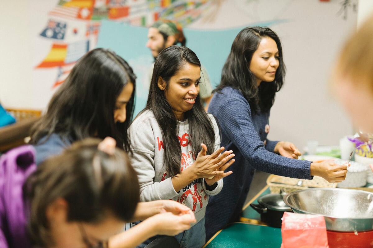 Group of people making food together