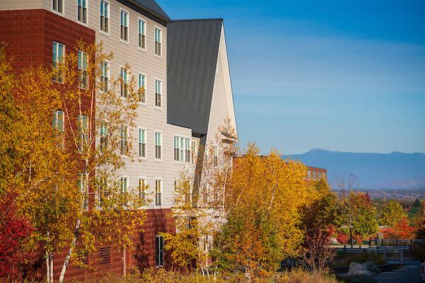 Exterior view of University Heights building with mountains in the background