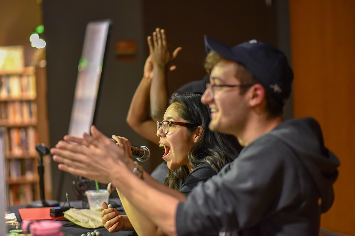 Students clap and cheer at an event