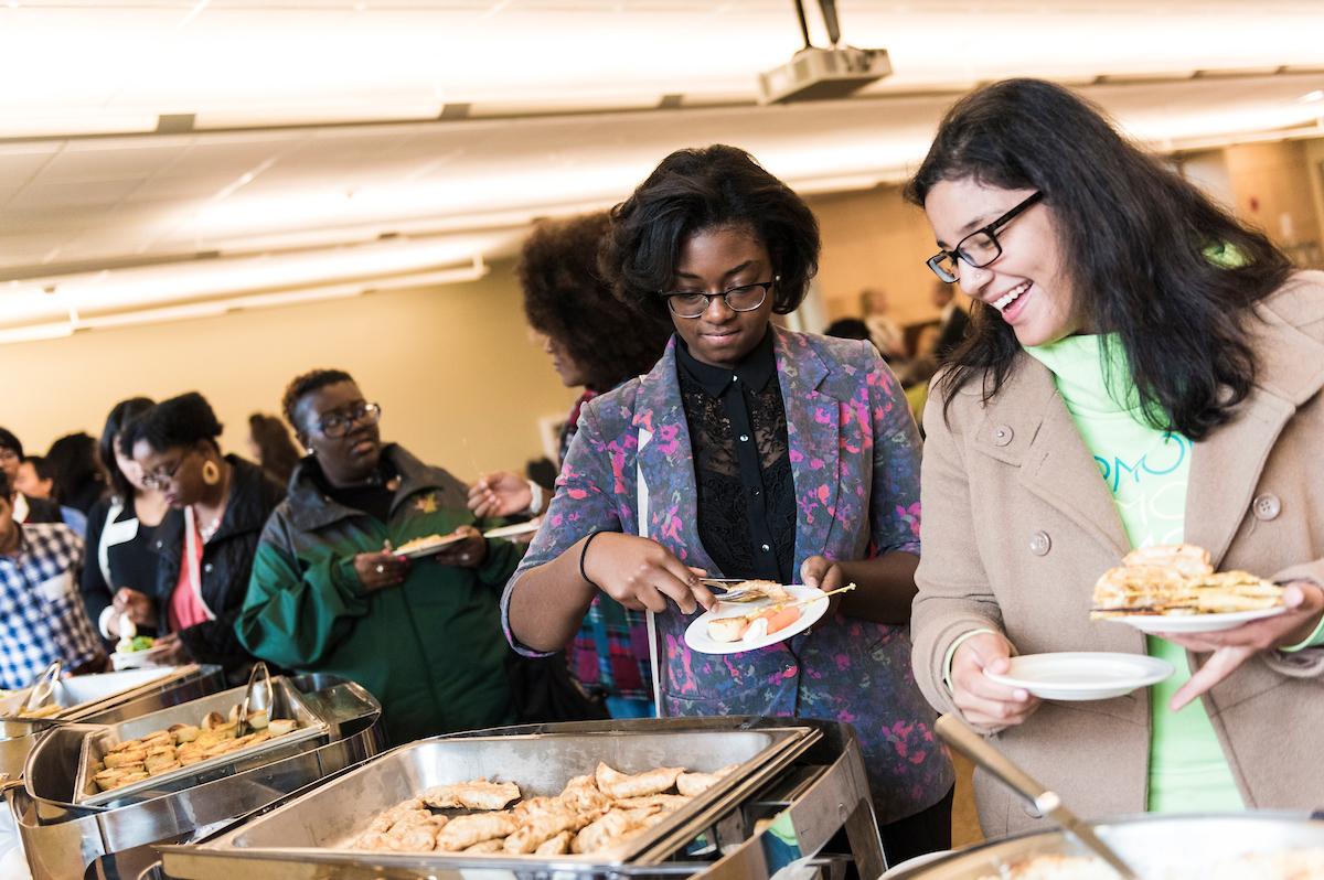 People get food at a buffet