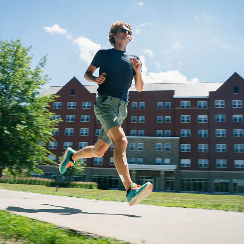 a person runs with sensors on their leg