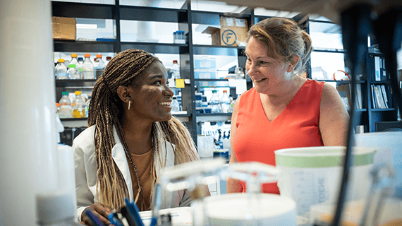 A student and professor work together in the lab