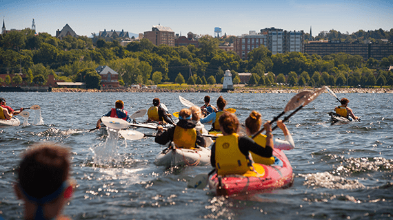 Kayakers in the lake facing Burlington