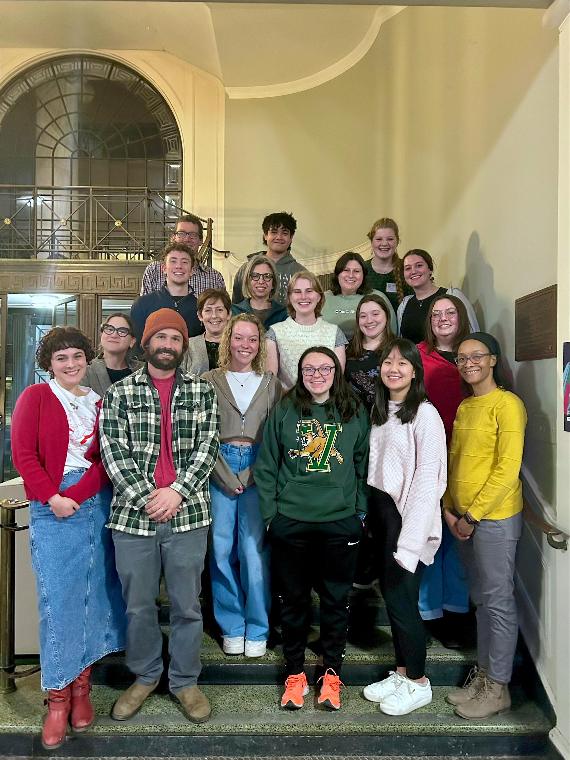 CESS Student Advisory Board members, faculty and staff gathered together on the staircase on the Waterman Building.