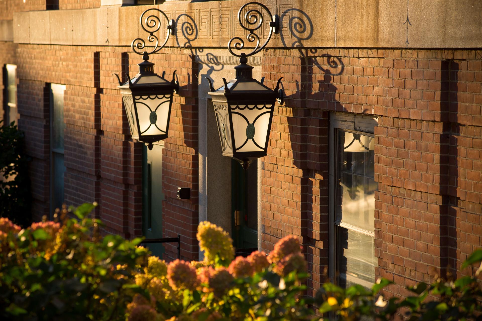 Lanterns on the side of brick building