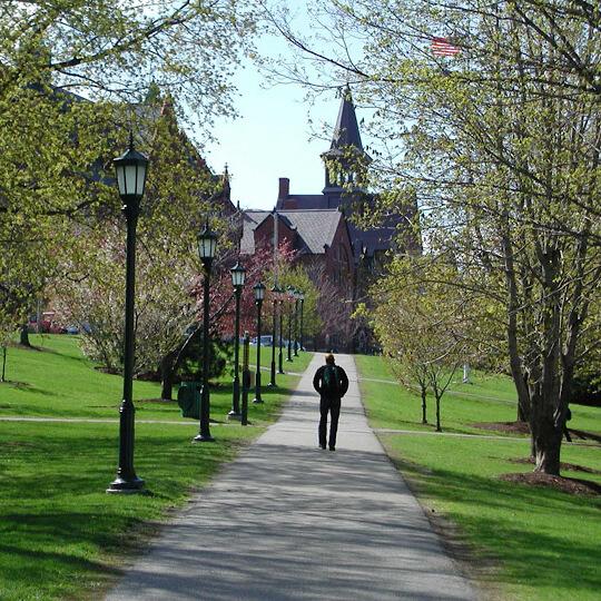 person walking on campus in spring