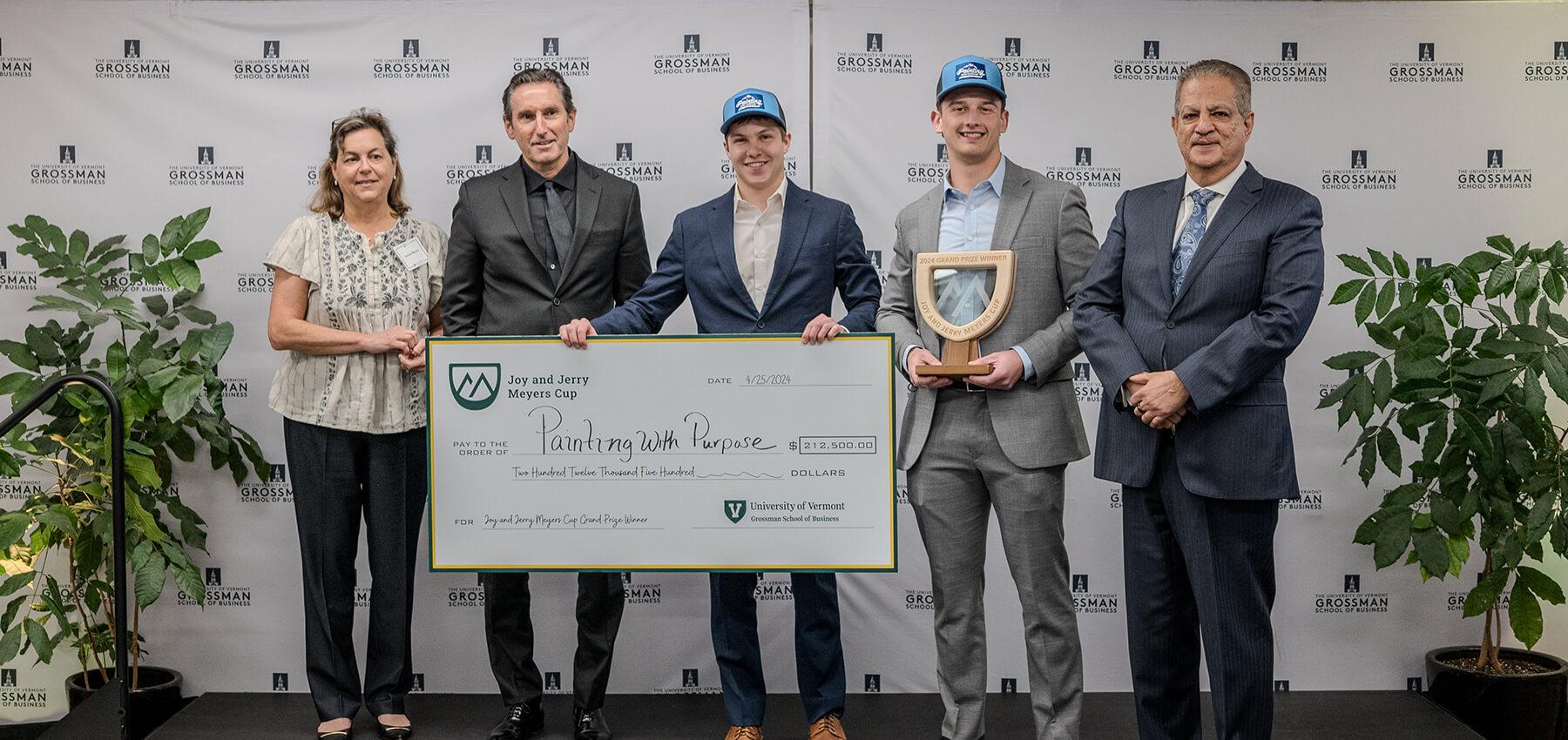 Painting with Purpose accepts the grand prize at the first annual Joy and Jerry Meyers Cup