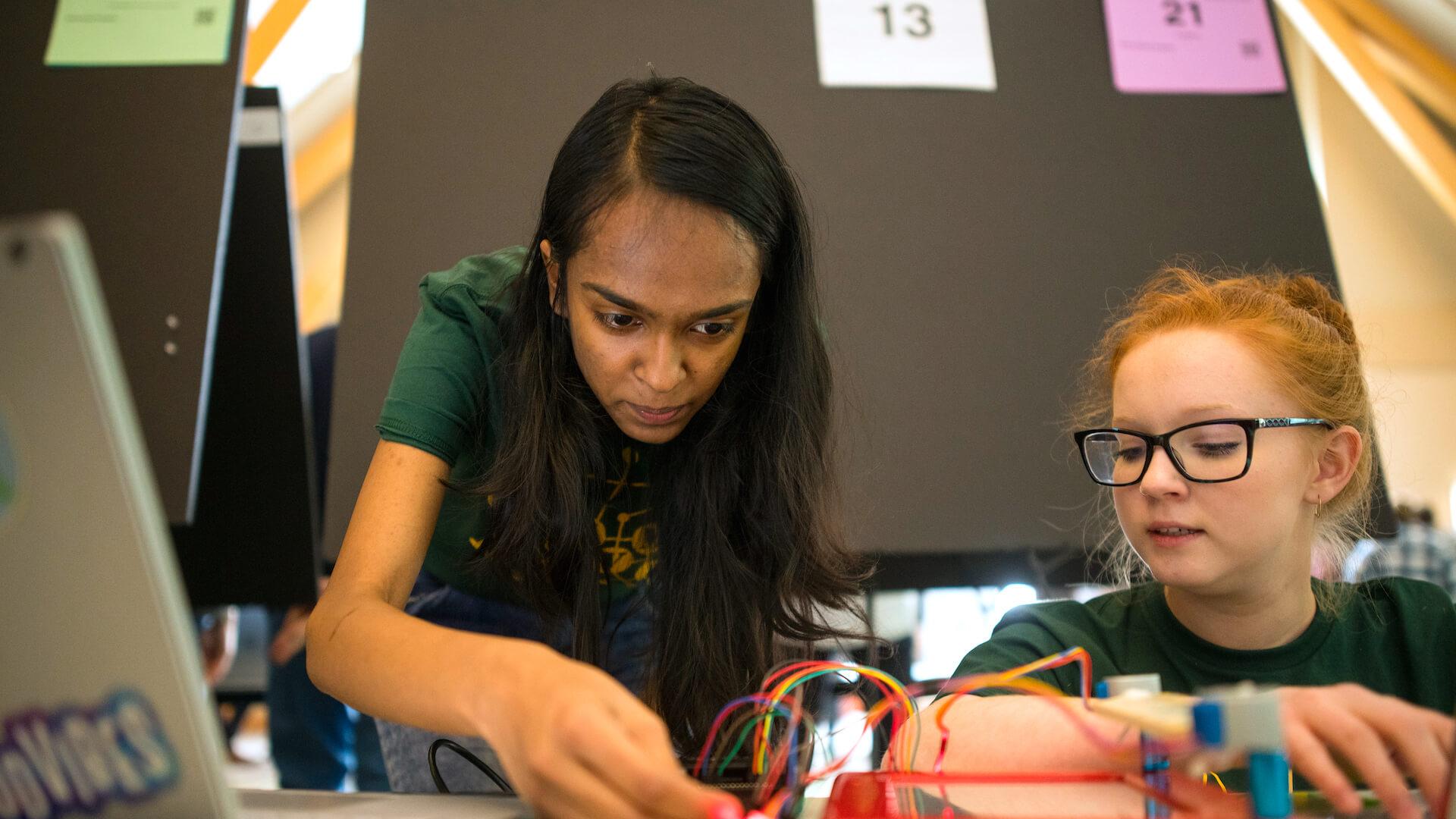 Two students working on a computer