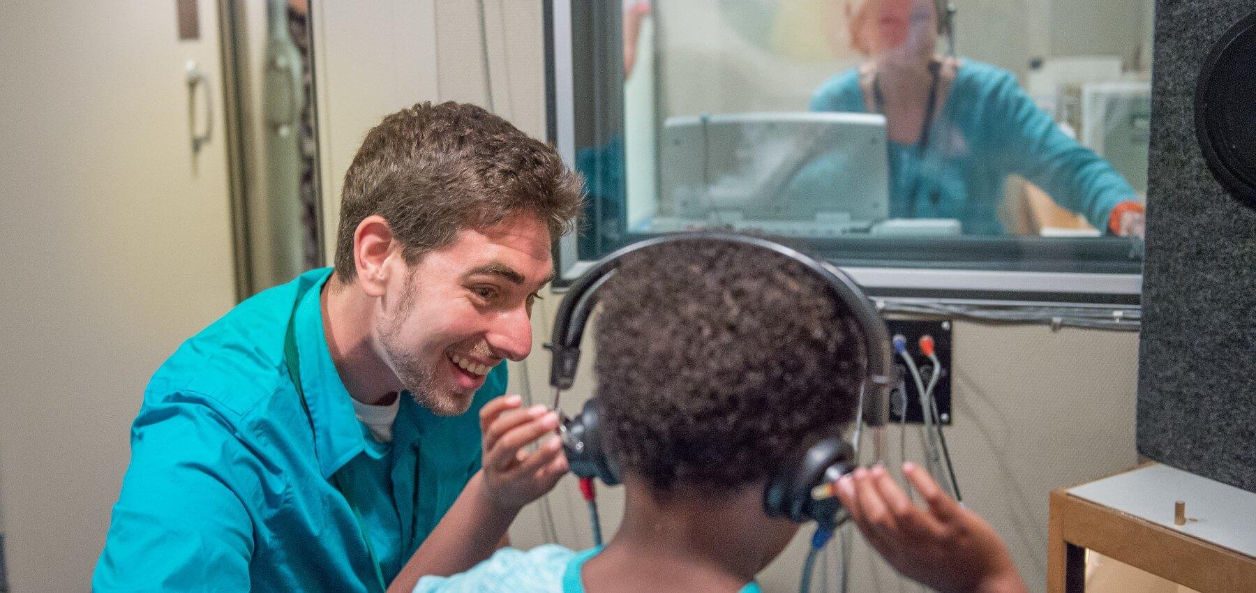 Student working with young client in the clinic