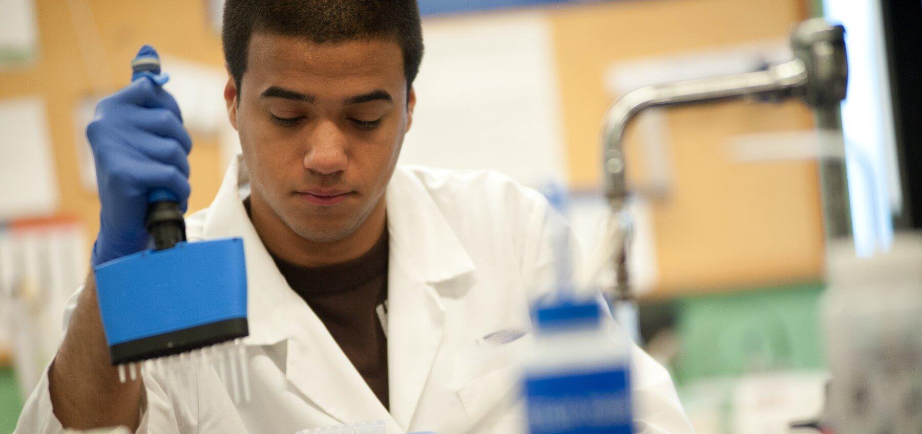 Student using pipettes in lab