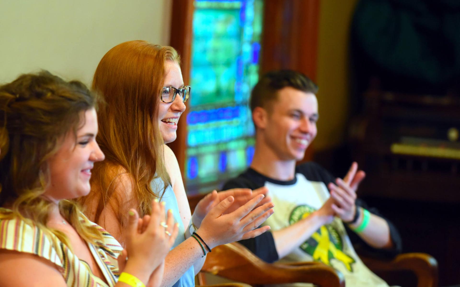 Social work students clapping as they enjoy a senior celebration group activity