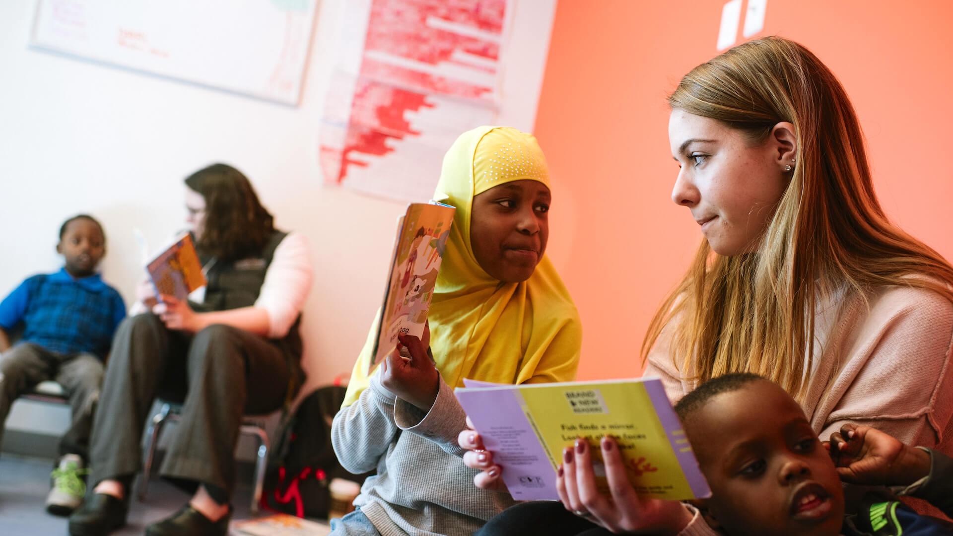Student working with culturally diverse youth at the King Street Center in Burlington.