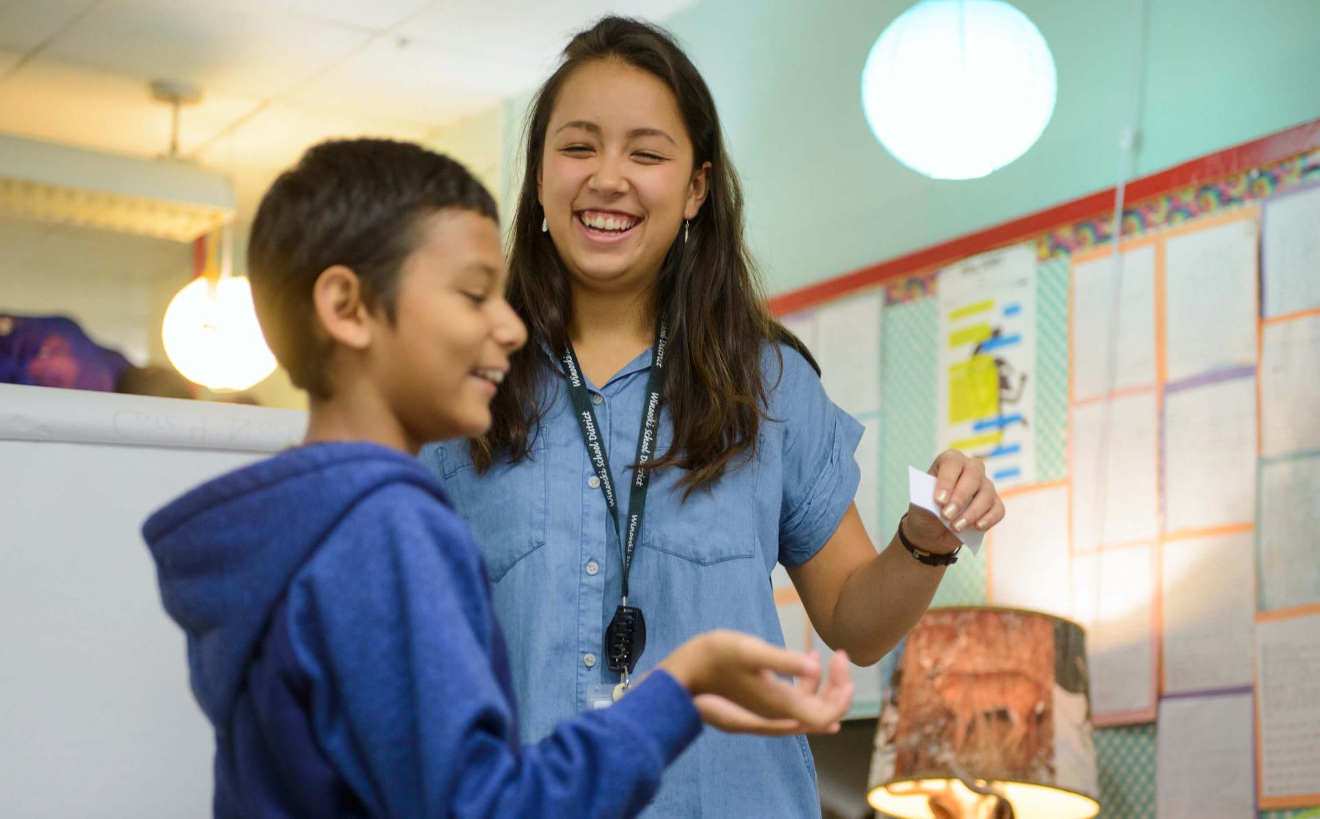 Student teacher works with middle schooler during internship placement at Winooski Middle School.