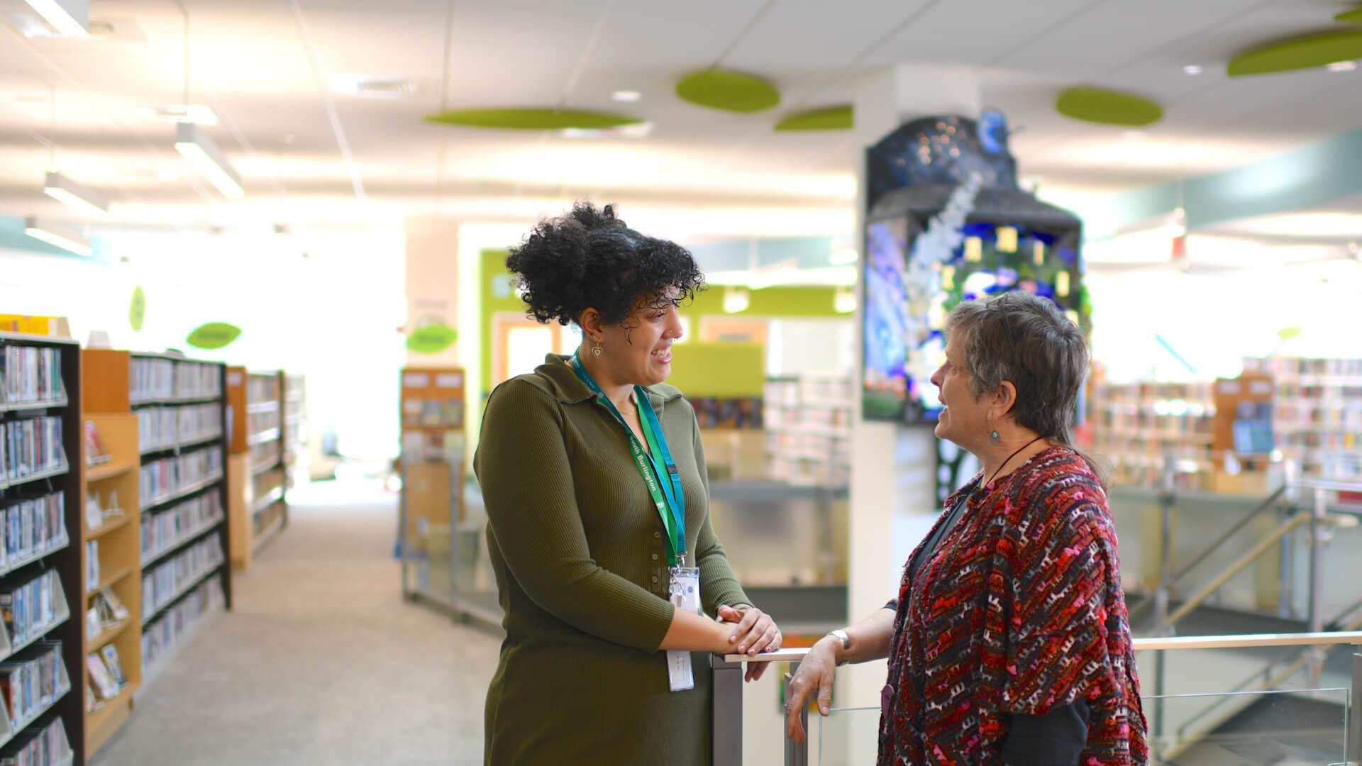 Social work intern converses with her site supervisor at the South Burlington Public Library.