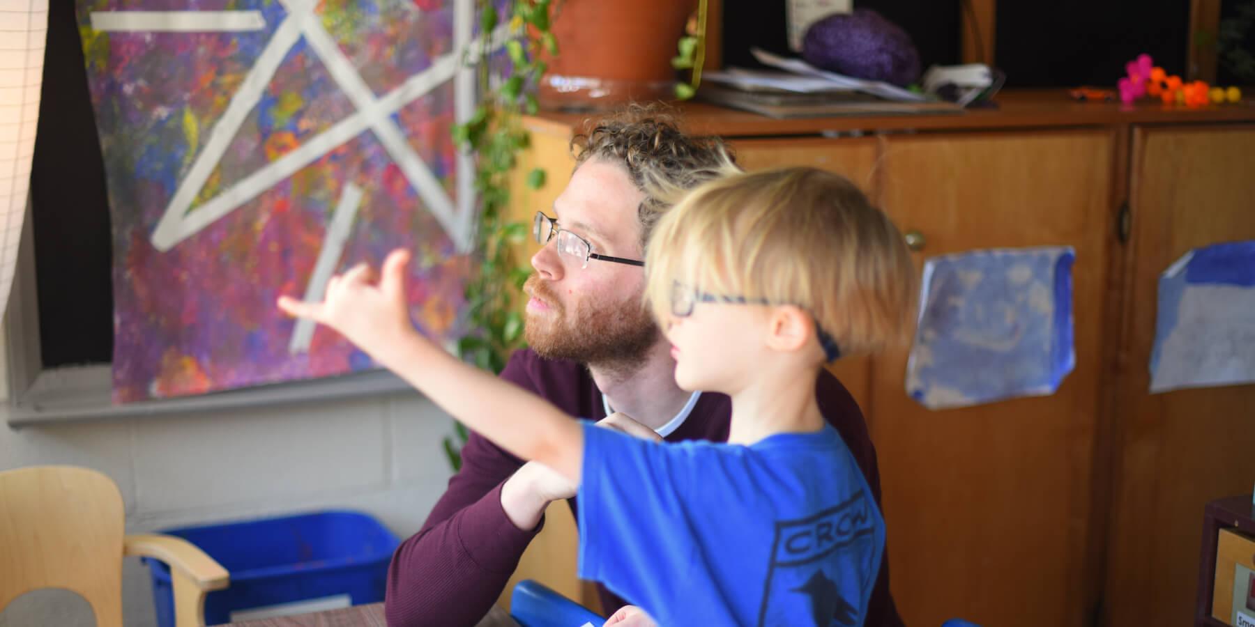 Special educator works with a student in a school classroom.