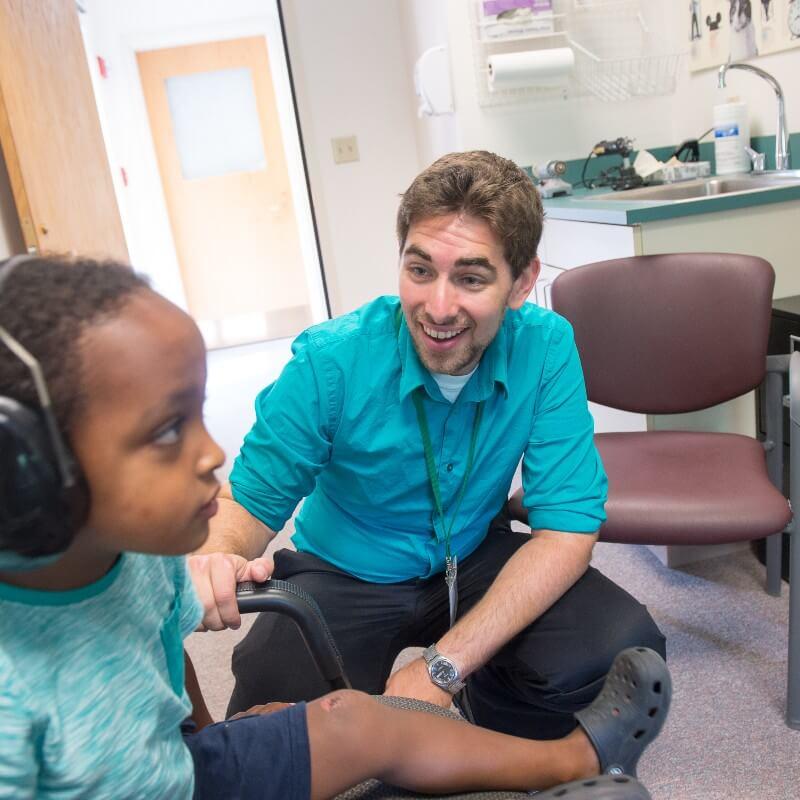 Graduate student with client in Luse Center