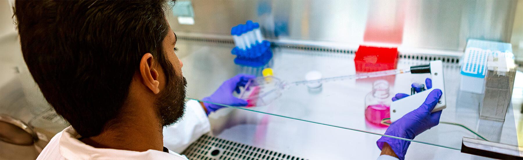 Graduate student at work in a CEMS lab
