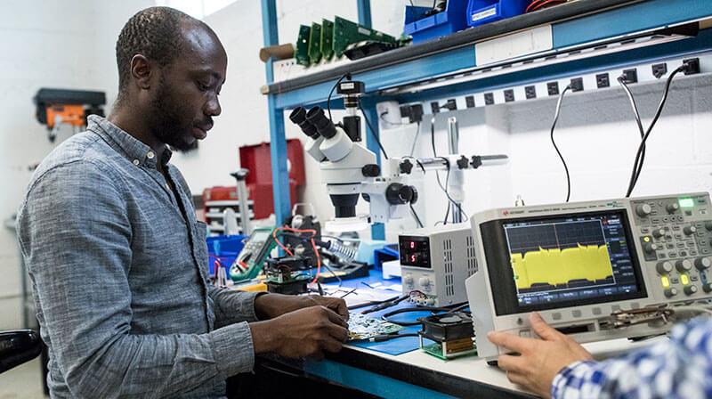 Electrical Engineer working in lab space
