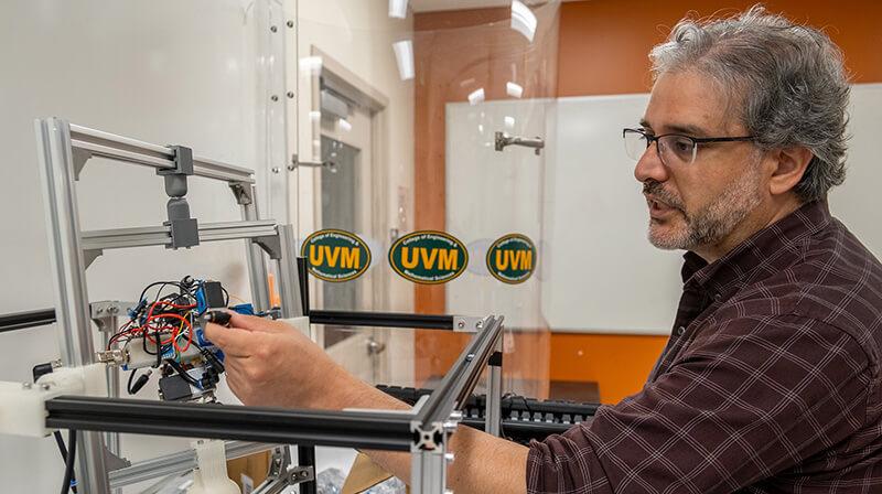 Professor Luis Duffault works in his autonomous technology lab