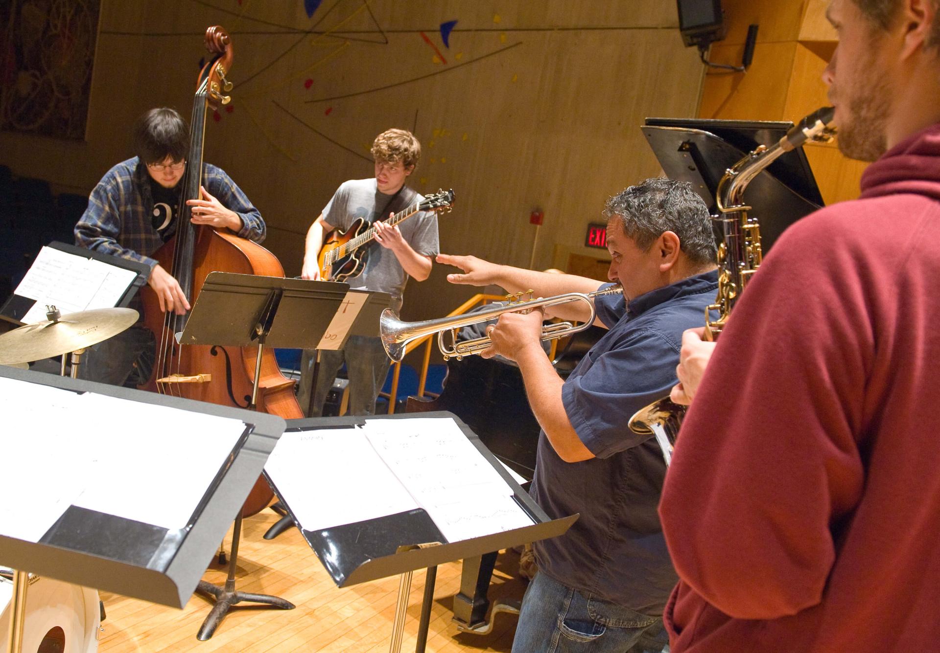 Musical group plays together.