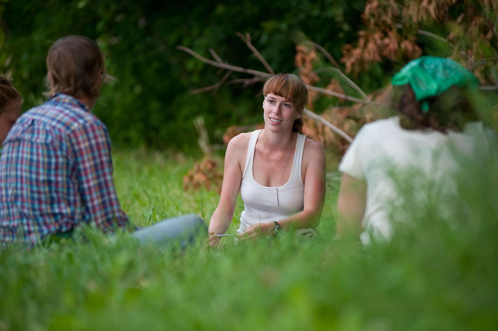 Students sitting in a field