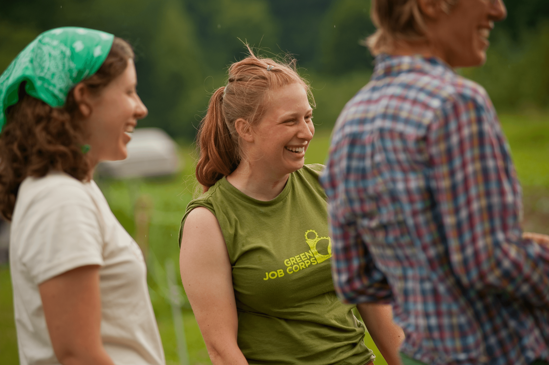 Students in a field laughing