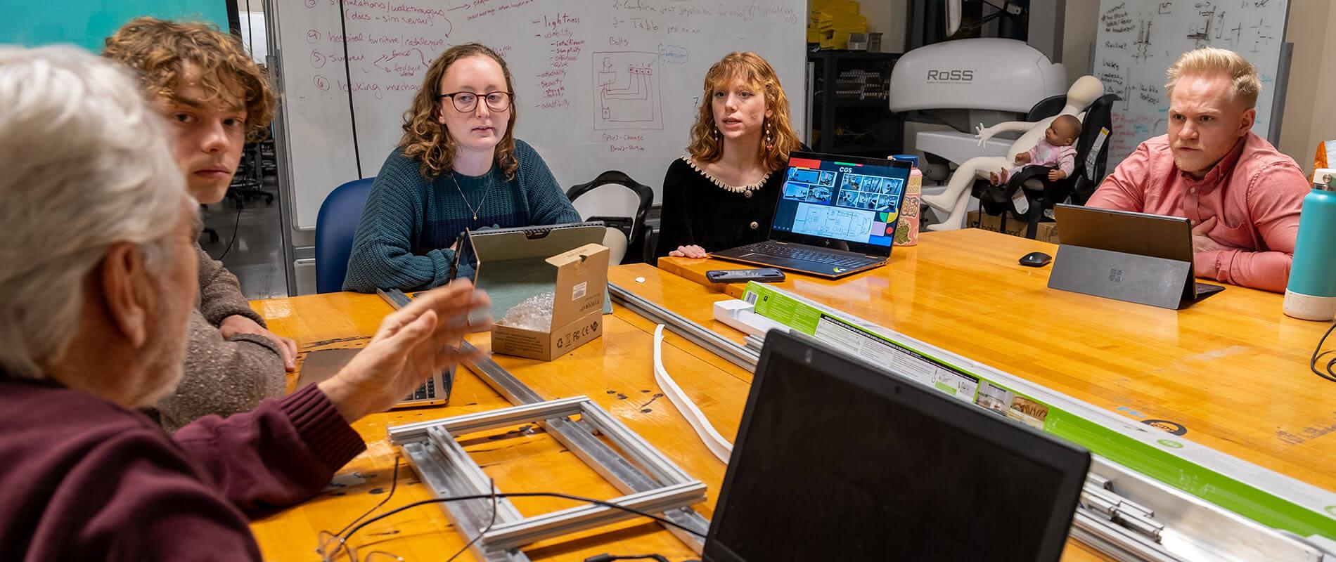 A CBI research team meets to discuss a new design project
