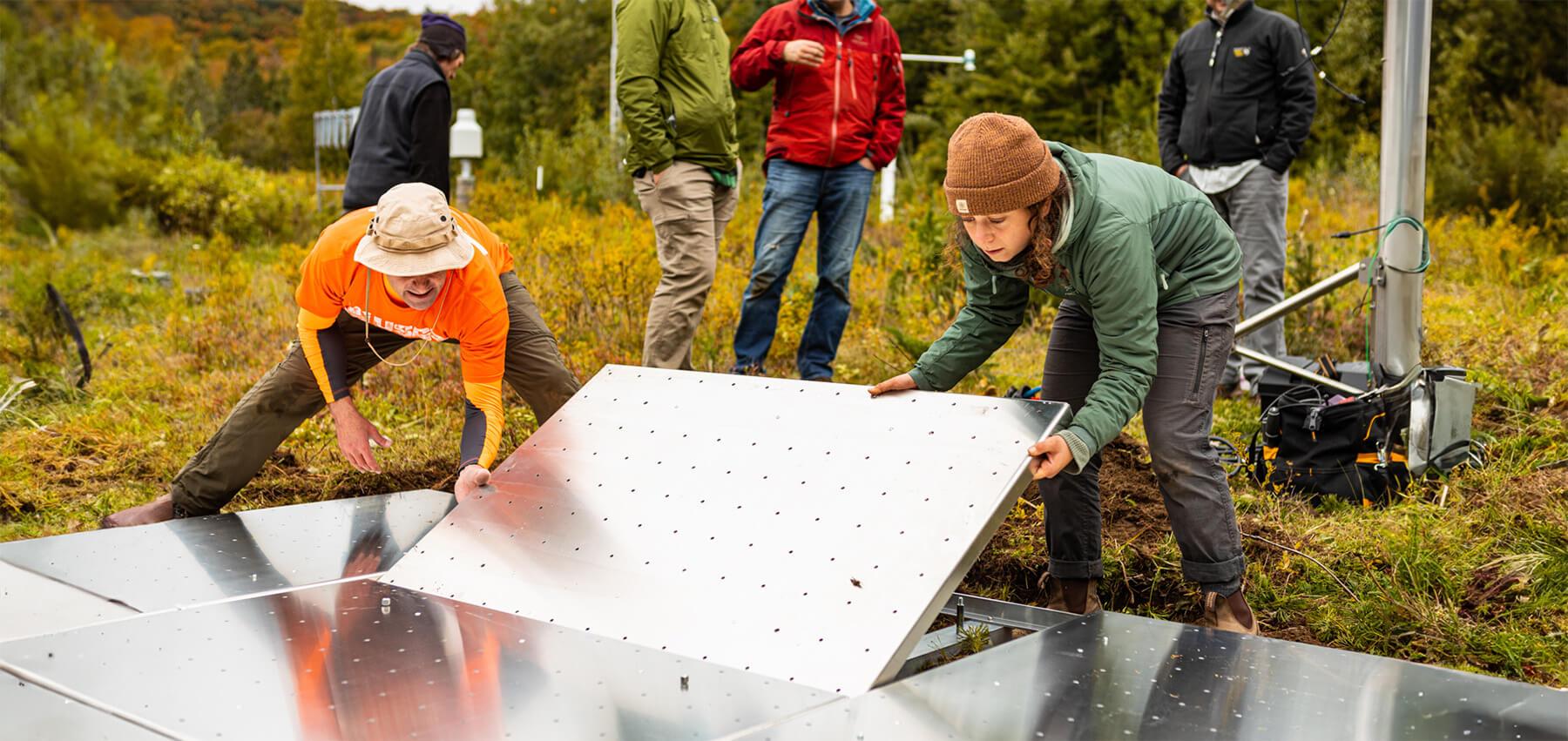 Researchers laying out equipment for snow research