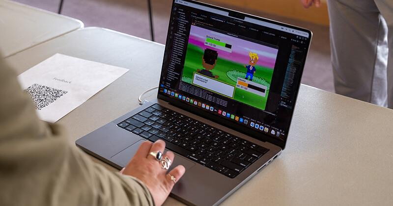 View of a laptop featuring a student crafted game during the Computer Science Fair