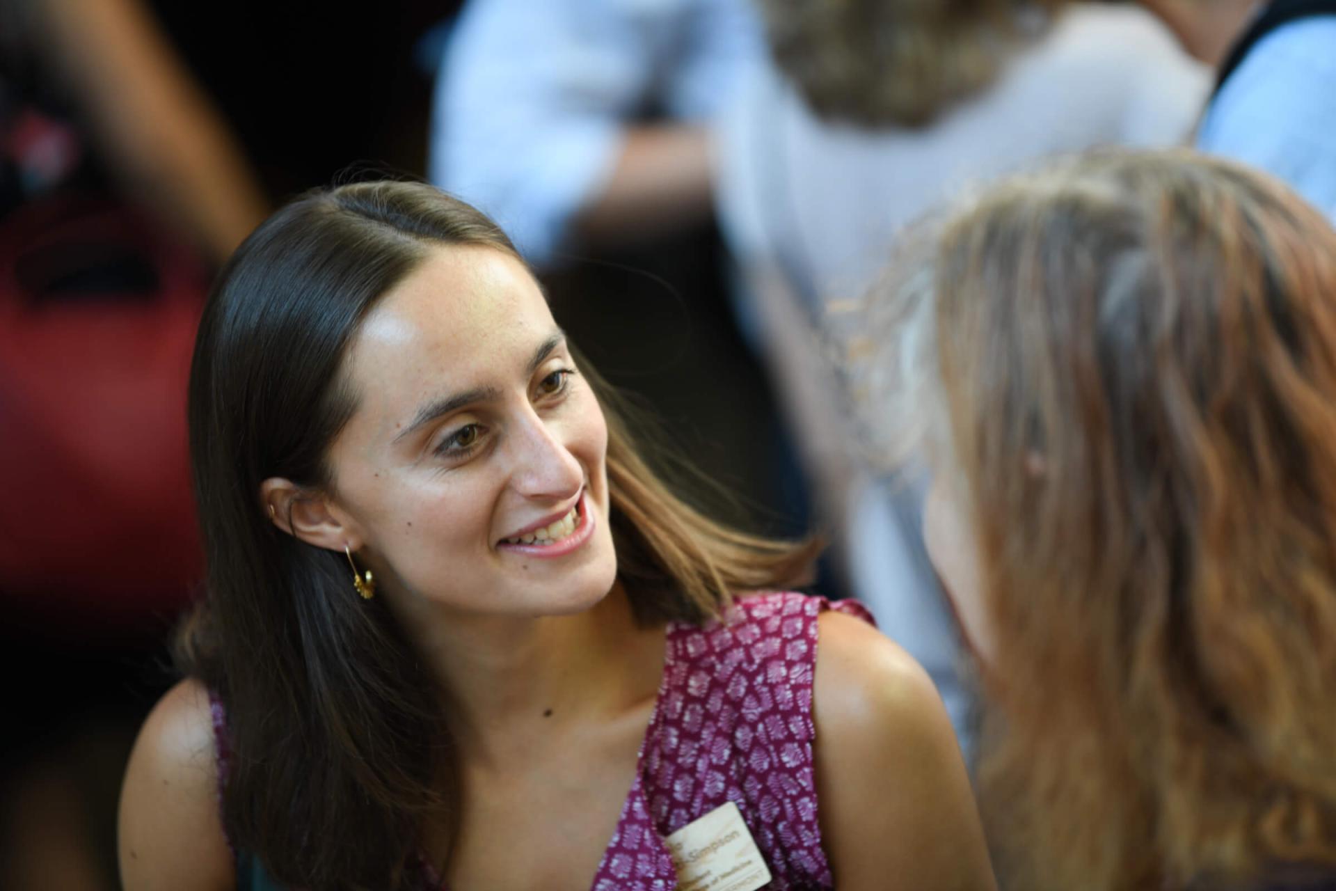 Student smiling during a conversation