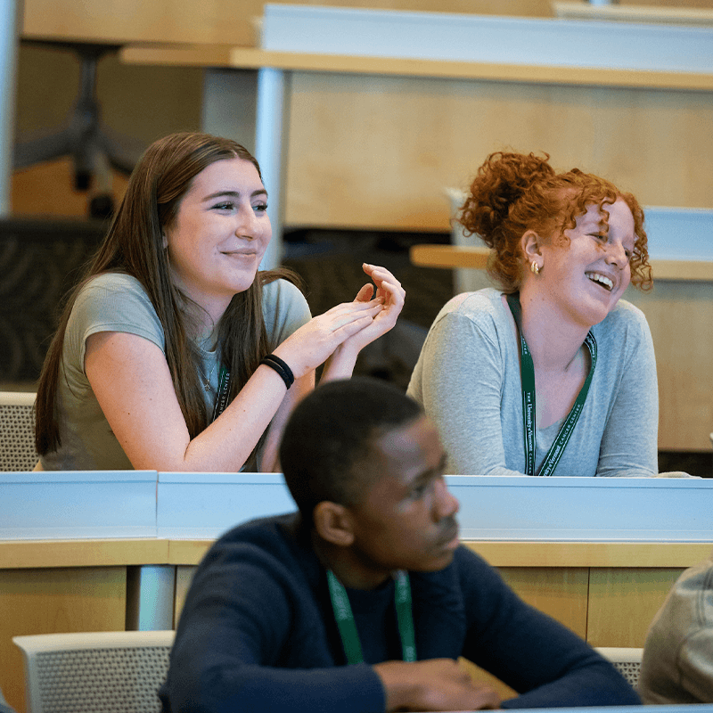 Three high school students in a classroom.