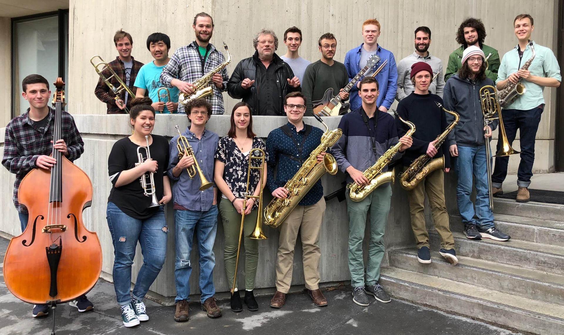 UVM students standing with their instrument