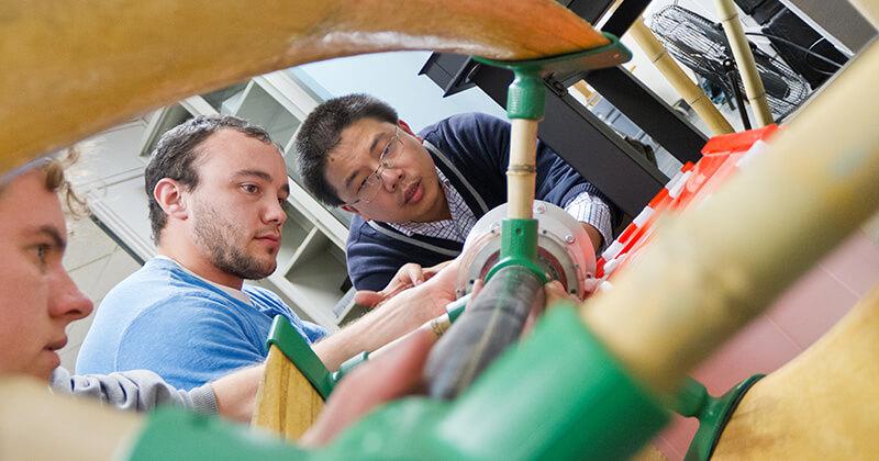 CEE students work with their professor on a wind turbine
