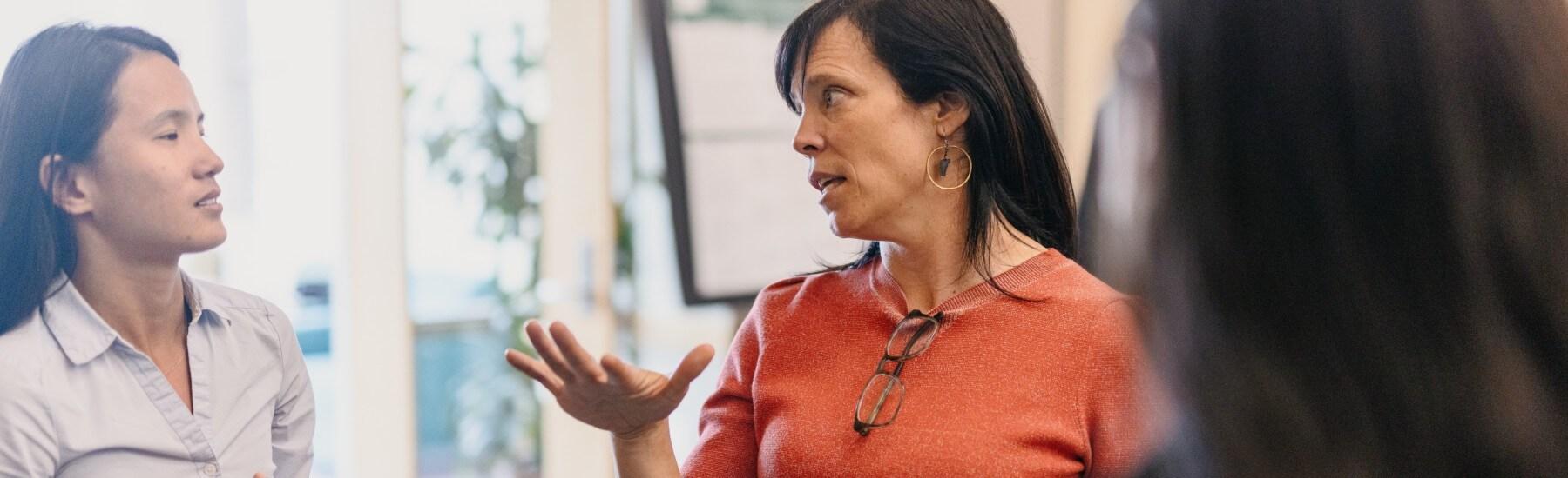 Professor Deb Hinchey speaks with a student at the Zeigler Forum