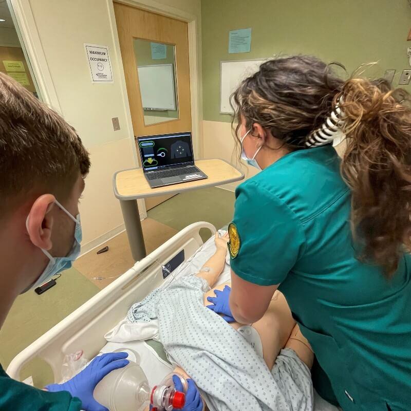 A nursing student practices CPR