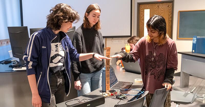 A team of CS students demonstrate their project using a Raspberry Pi