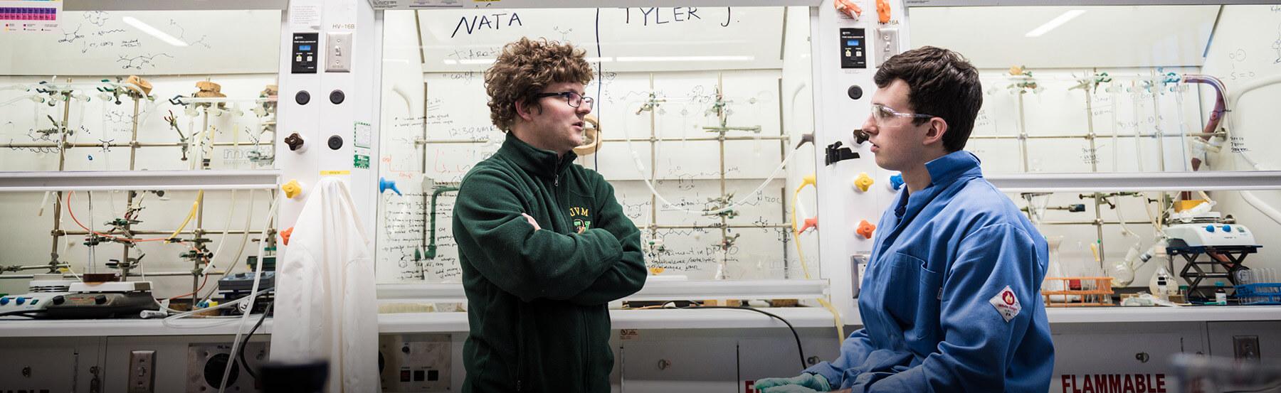 Two students working in a chemistry lab