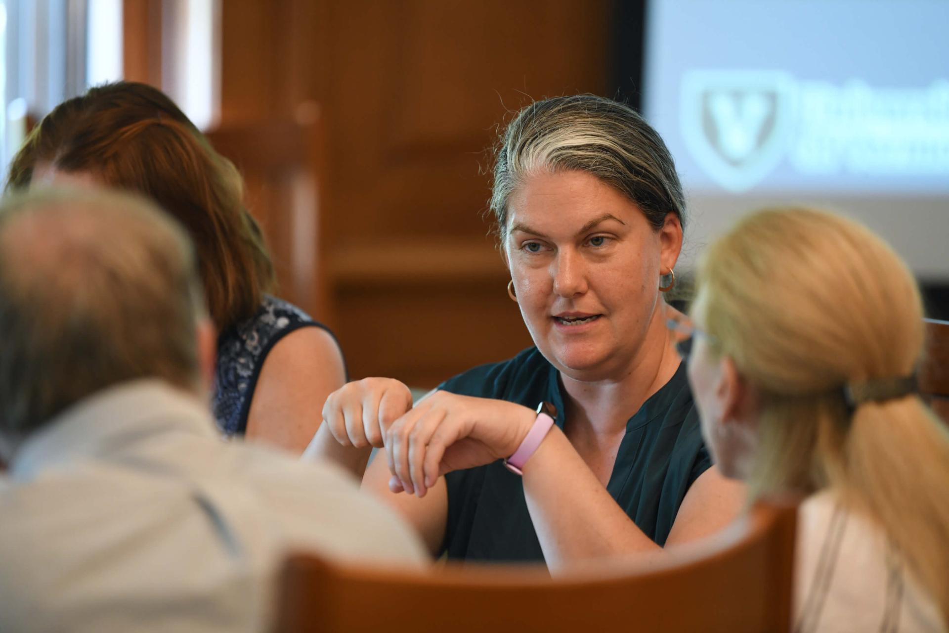 Faculty member Daniella Sutherland engaging with doctoral students.