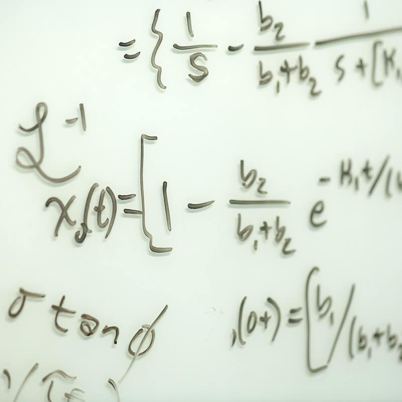Handwritten equation on the white board