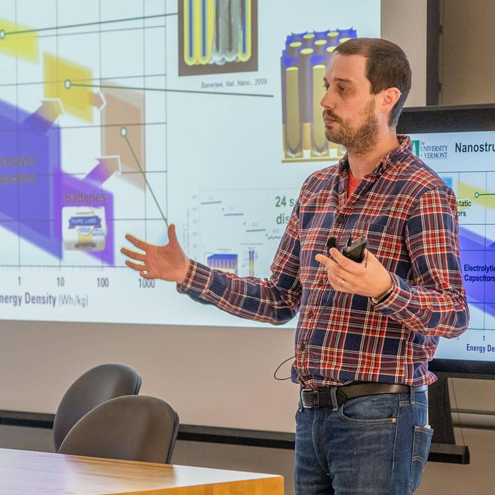 Physics faculty member Alex Kozen sharing presentation on new research