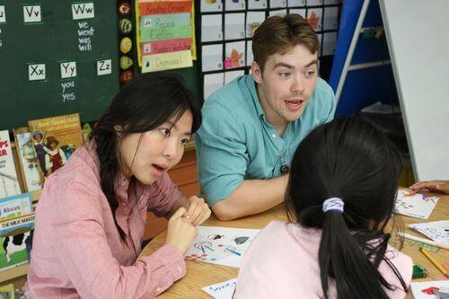 Chinese students teaching elementry students