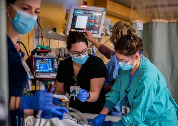 three people in clinical setting