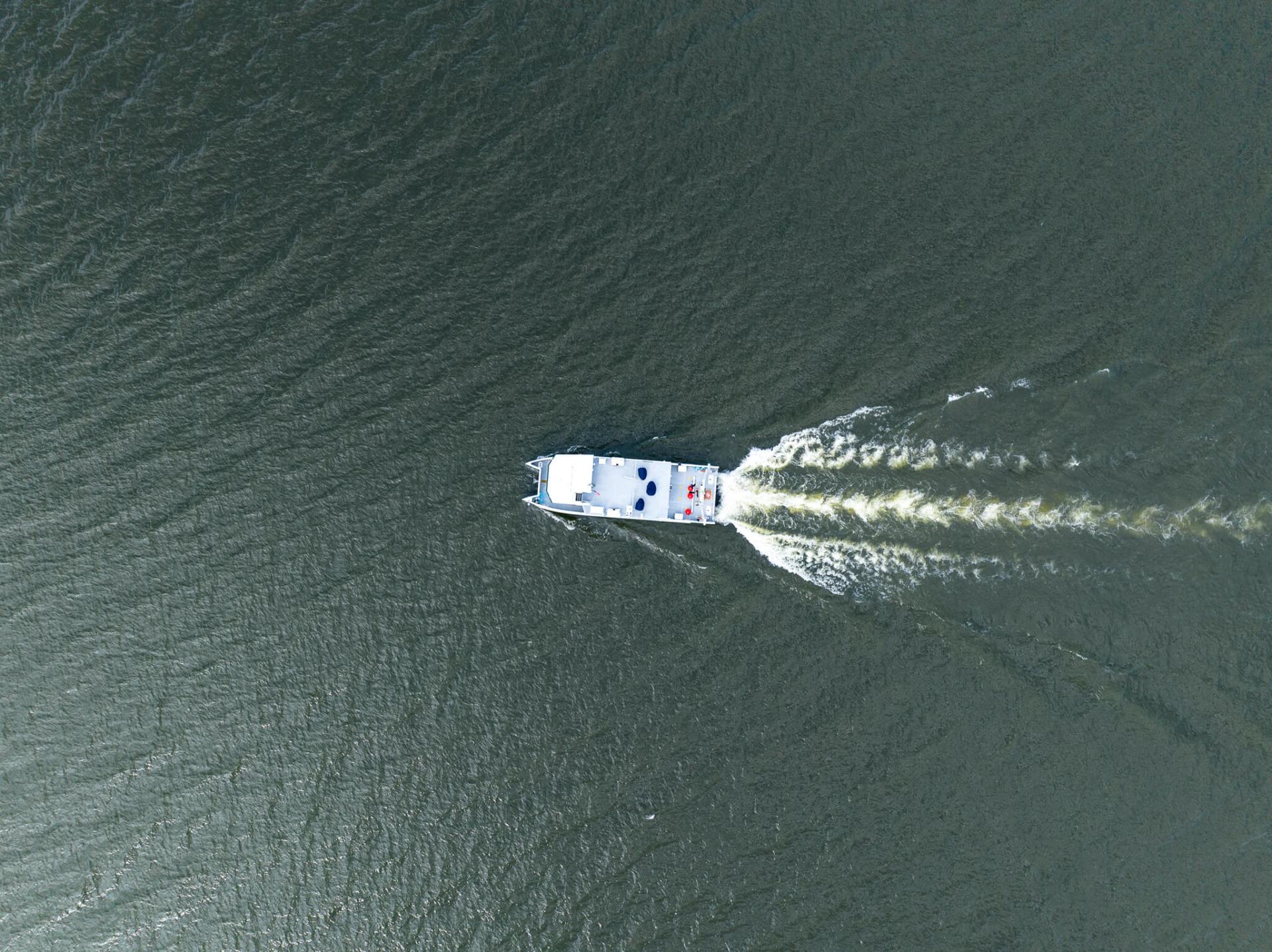 An aerial view of a boat on water