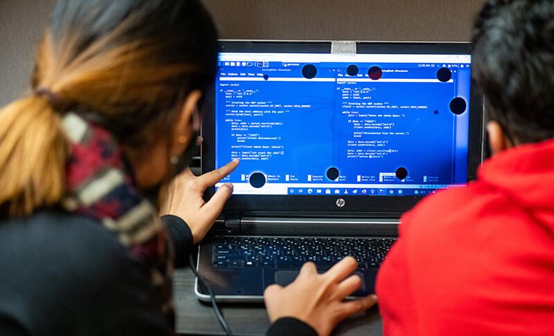 Students working together on a laptop