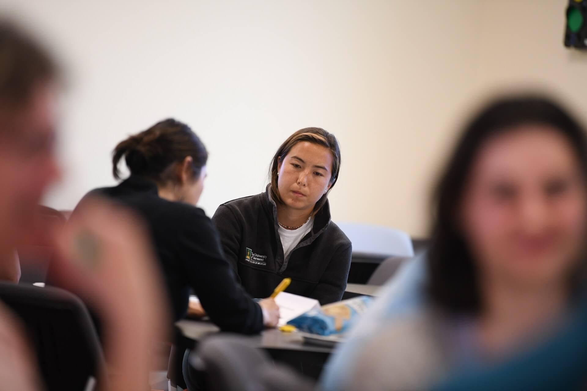 Two students working at a desk